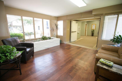 A bright and inviting lobby with modern furnishings and natural elements.