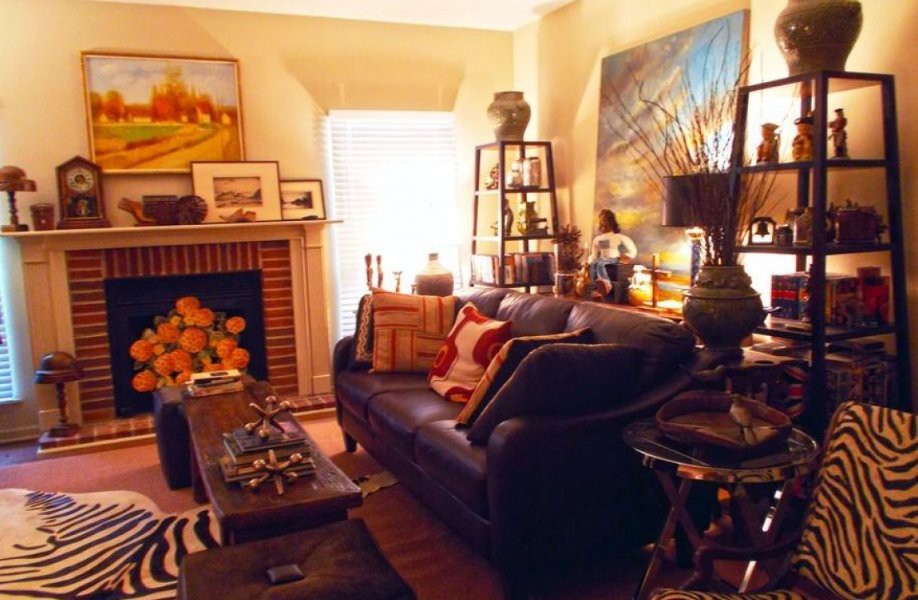 A cozy living room adorned with artwork and a warm atmosphere.