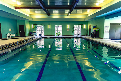 A serene indoor swimming pool, perfect for relaxation and fitness.