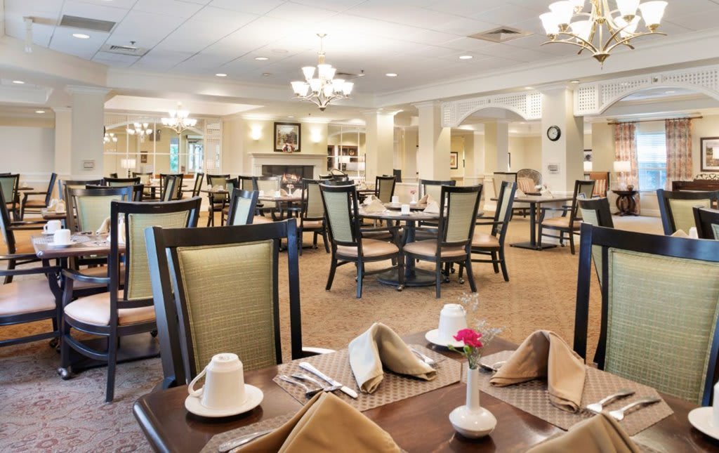 An elegant restaurant dining area with neatly set tables and comfortable chairs.