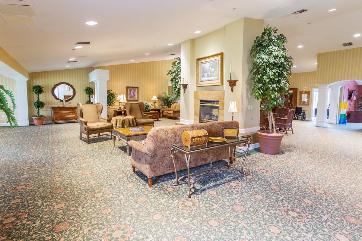 A cozy and well-decorated lobby with comfortable seating and indoor plants.