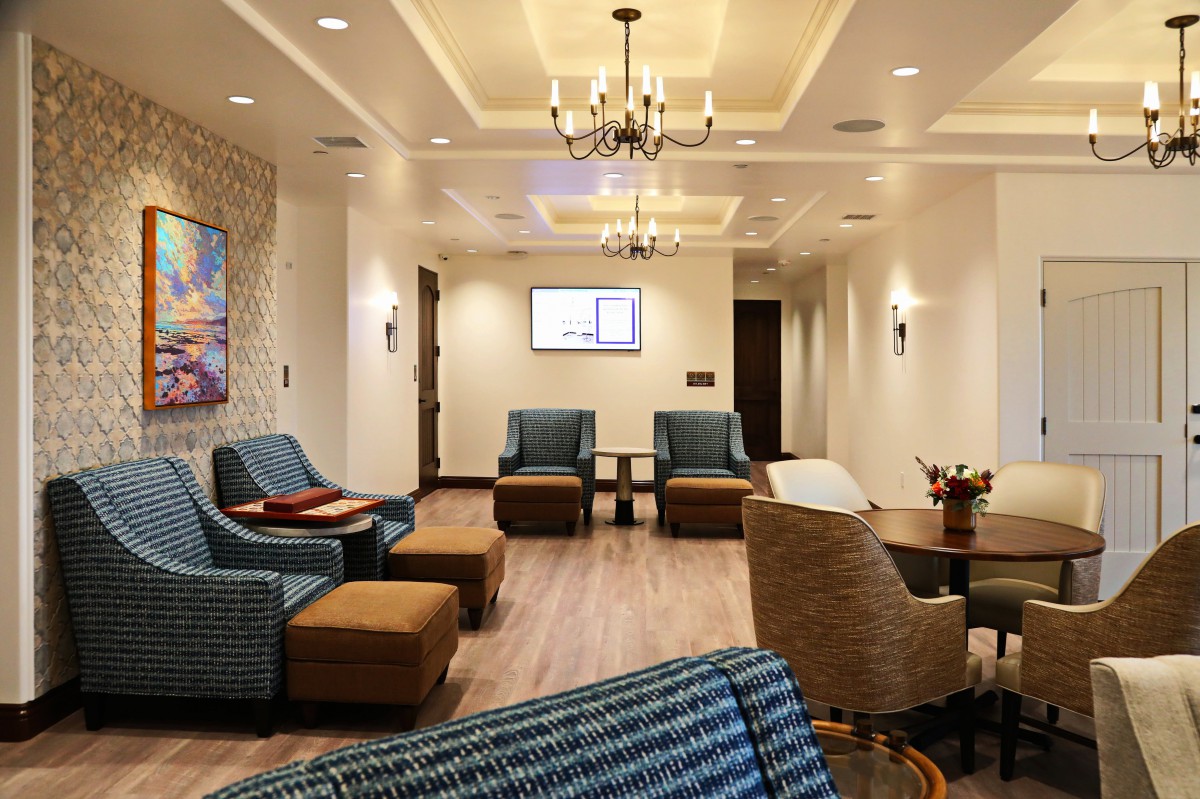 A beautifully designed waiting room with comfortable seating and elegant lighting.