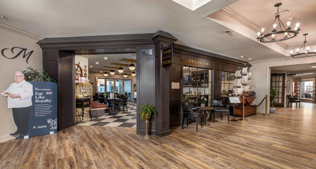 A modern restaurant interior with elegant decor and wooden flooring.
