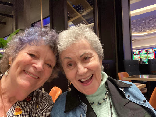 A joyful moment captured in a selfie with two friends enjoying their time together.