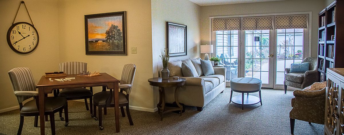 A cozy living room with modern decor and a dining area.