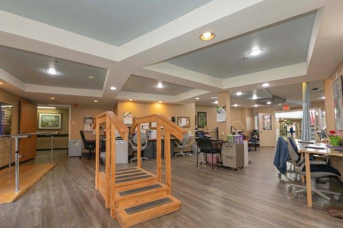 A spacious rehabilitation center equipped with exercise tools and facilities for physical therapy.