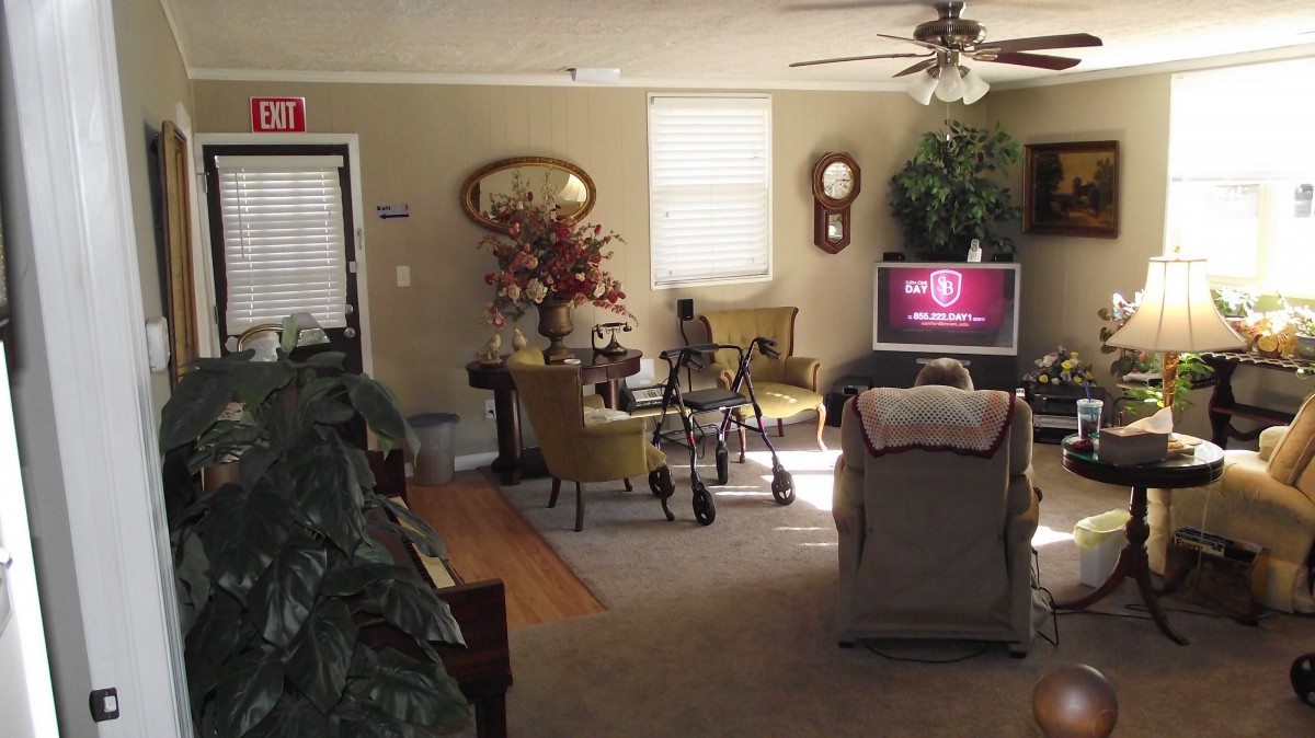 A cozy living room with traditional decor and a television.