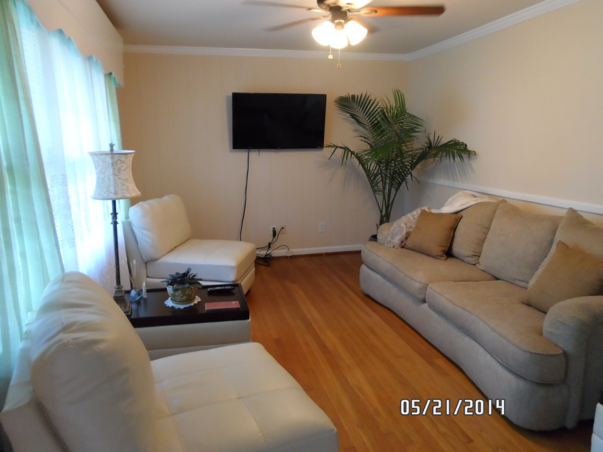 Images showing bedroom, windows, living room, television, plant, and more.