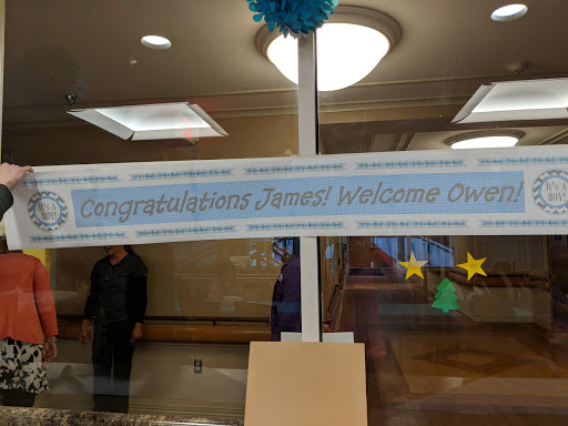 A celebratory banner displaying congratulations for an event, decorated with stars.