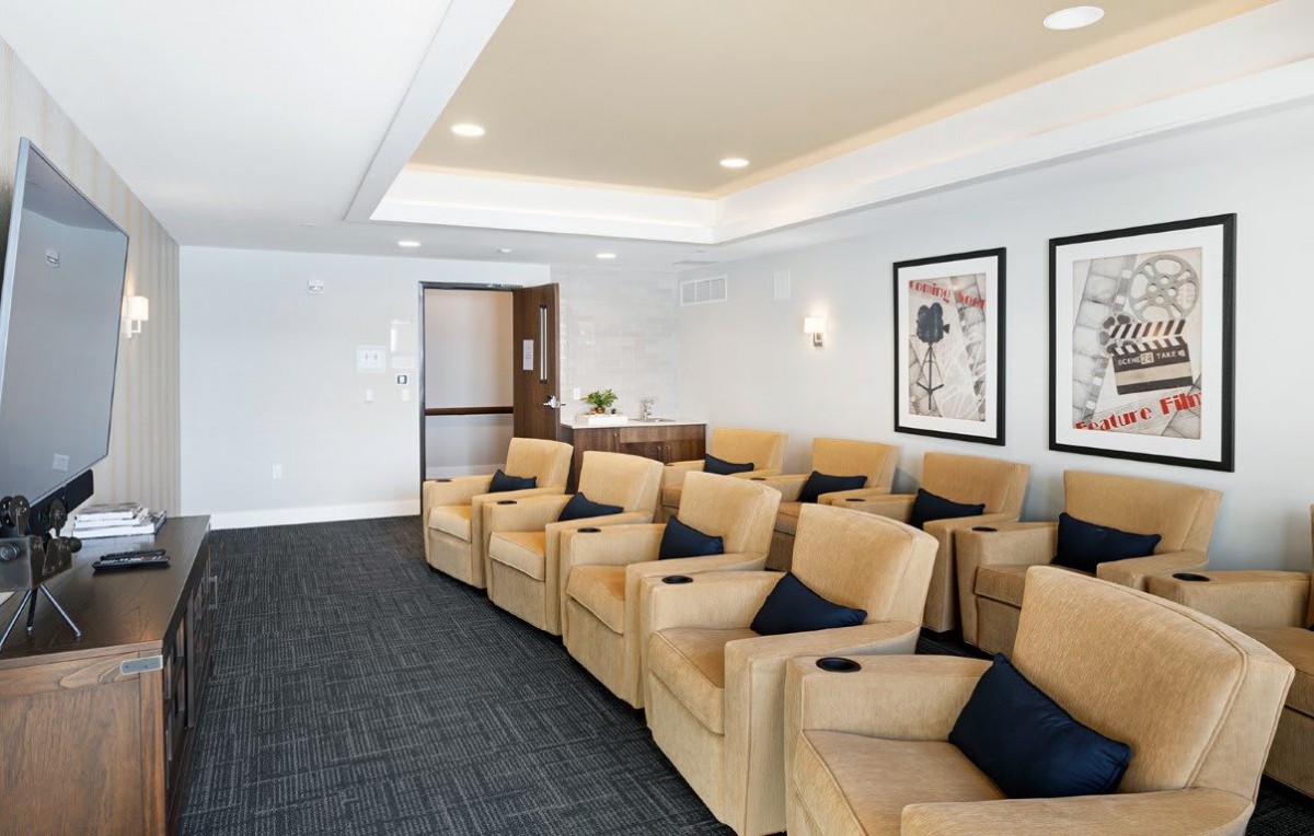 A luxurious home theater room with comfortable seating and modern decor.