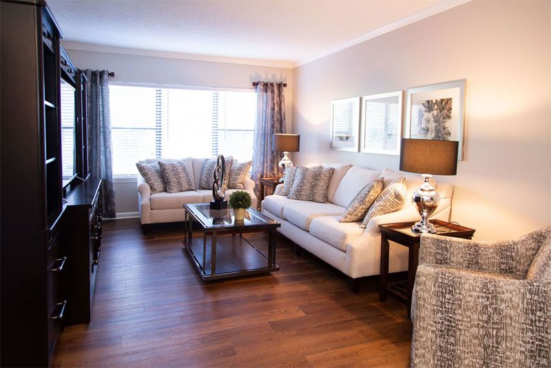 A stylish and bright living room with comfortable sofas and elegant decor.