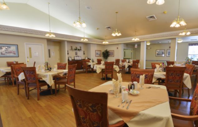 An elegant dining area with neatly arranged tables and comfortable seating.
