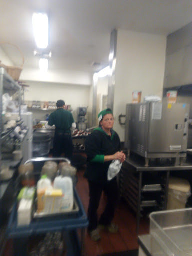 A busy kitchen with staff preparing food.