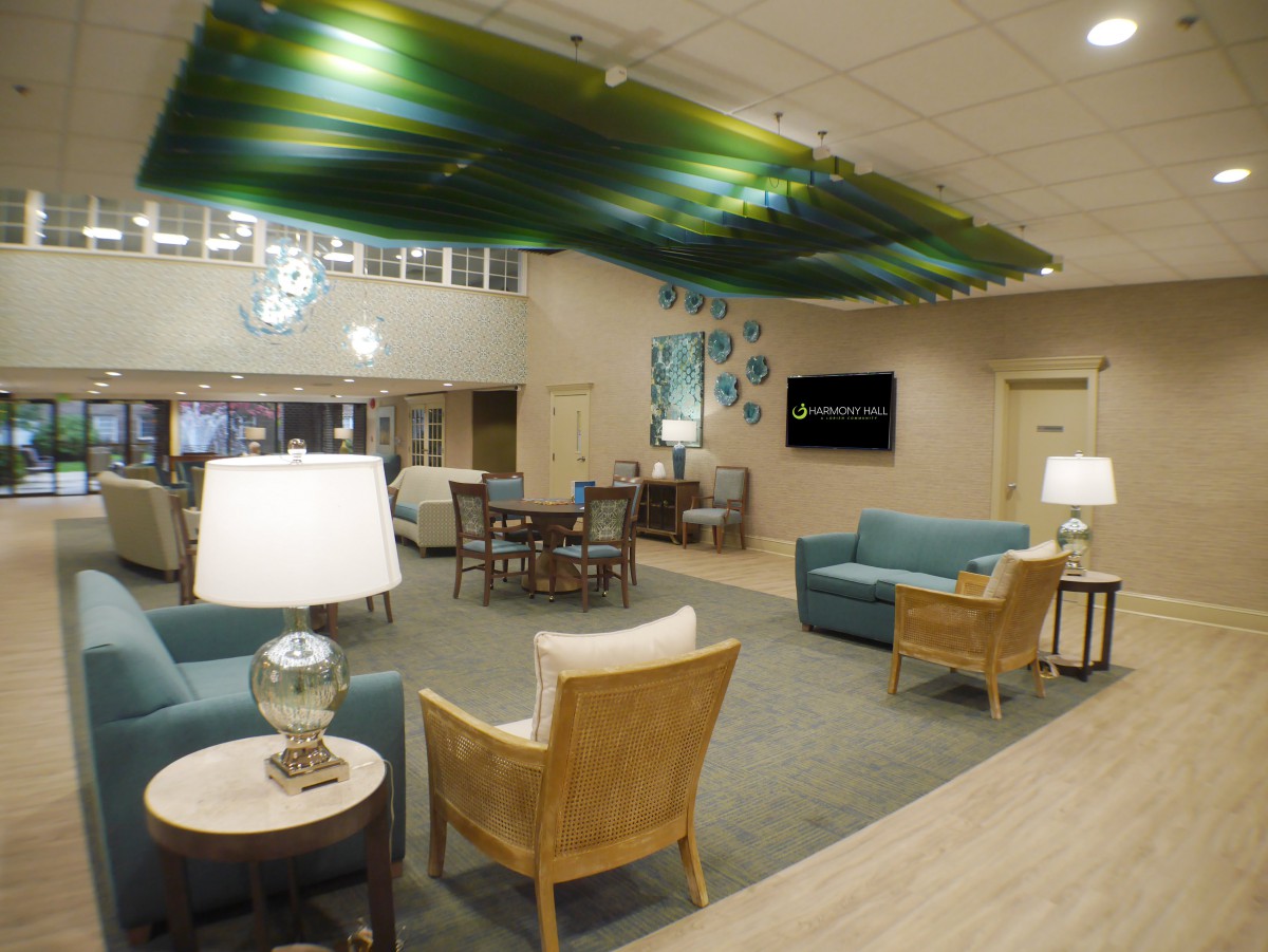 A modern lobby with comfortable seating and unique ceiling decor.