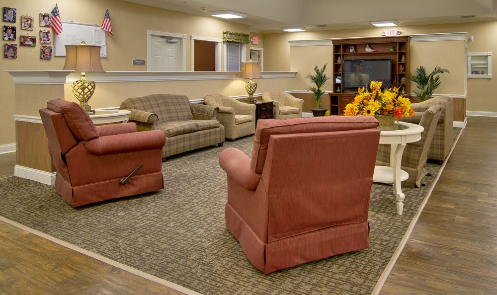 A cozy living room with comfortable seating and a television.