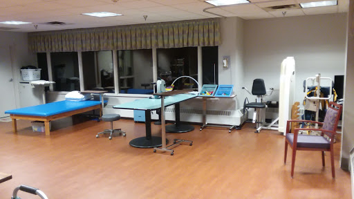 A view of a rehabilitation therapy room equipped with various treatment facilities.