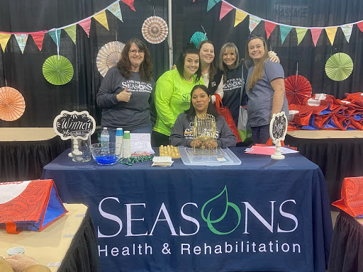 The team from Seasons Health & Rehabilitation showcasing their services at a local event.