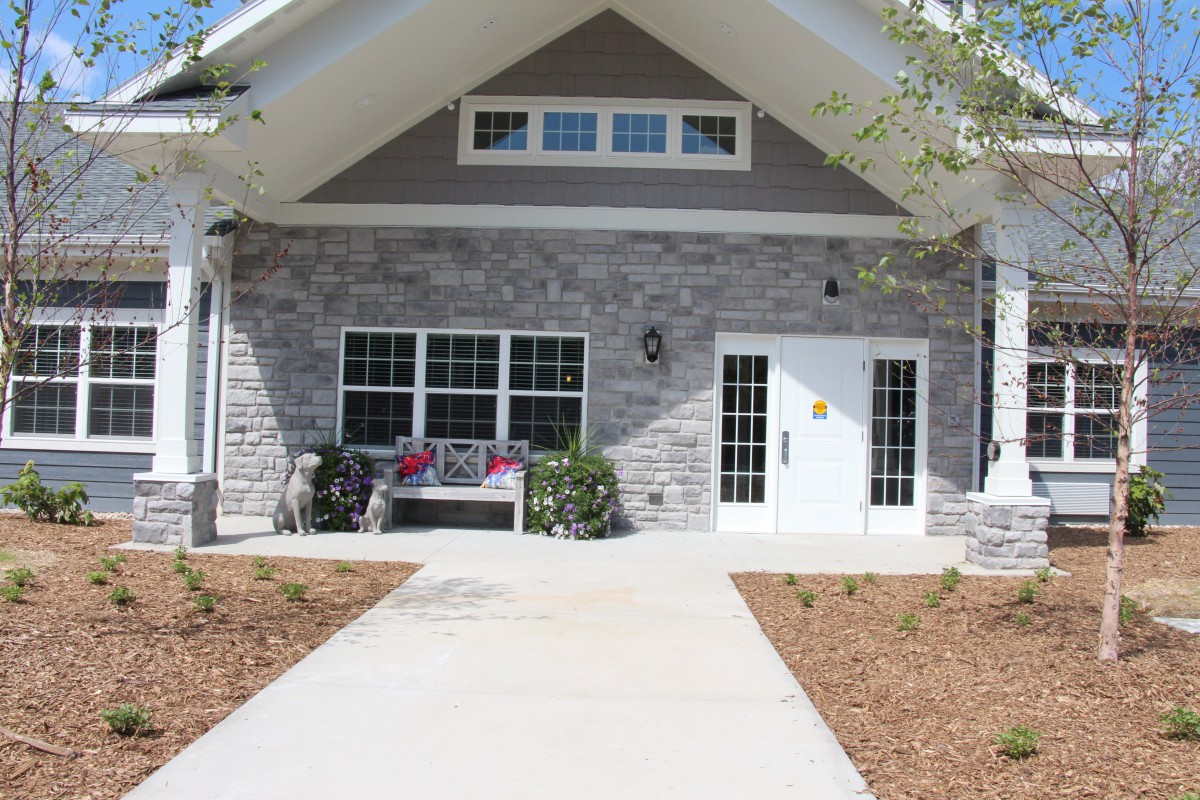 A modern house with a stone exterior and a welcoming entrance.