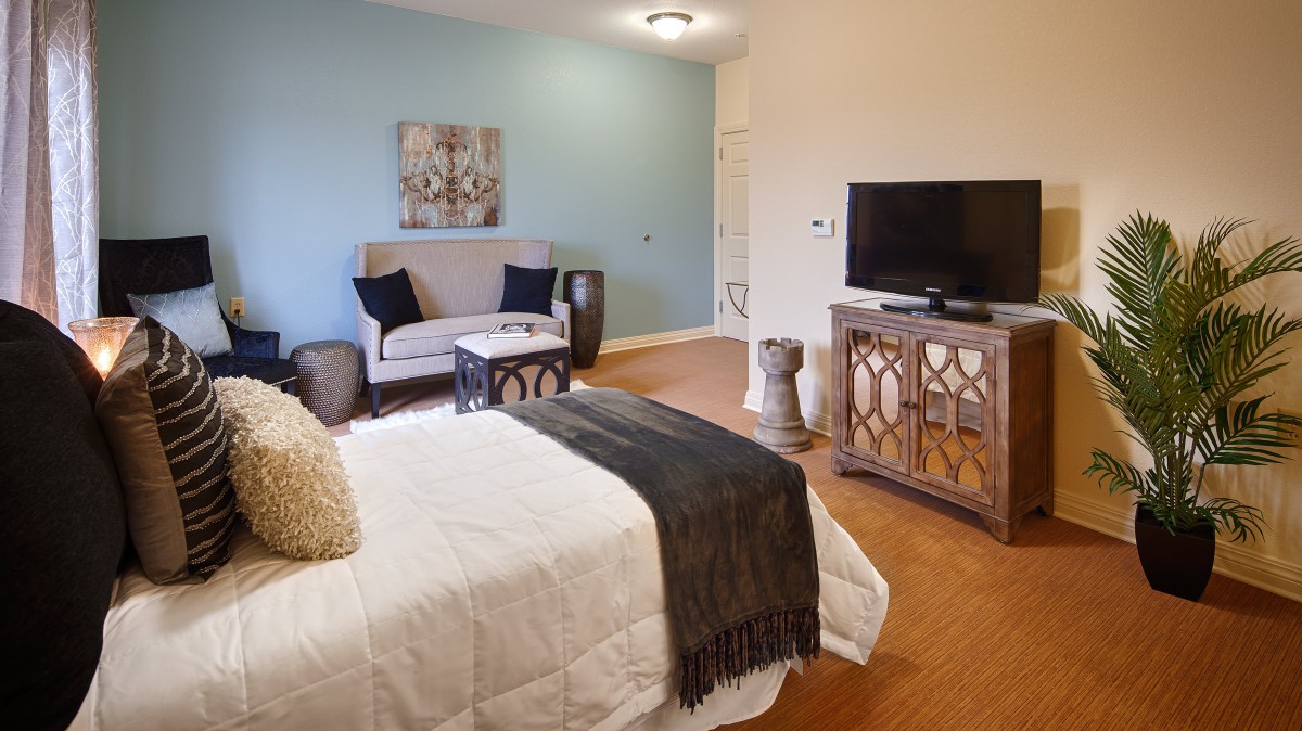 Modern bedroom with elegant furniture and a cozy atmosphere.