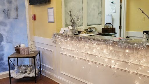 A cozy caf interior featuring soft lighting and a well-decorated counter.