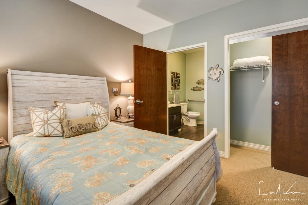 A cozy bedroom with an adjoining bathroom and closet.