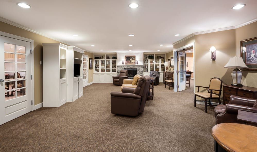 Spacious living room with comfortable seating and built-in bookshelves.