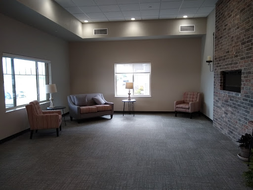 A spacious lounge area featuring comfortable seating and natural light.
