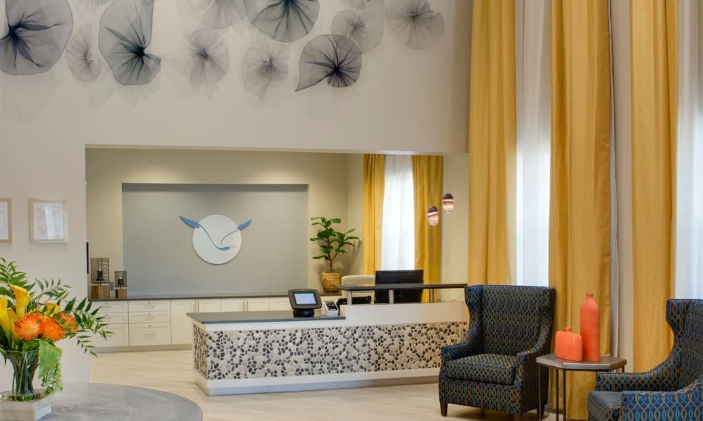 A modern hotel lobby with stylish decor and comfortable seating.