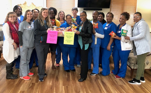 Healthcare team celebrating their efforts and contributions in a supportive environment.