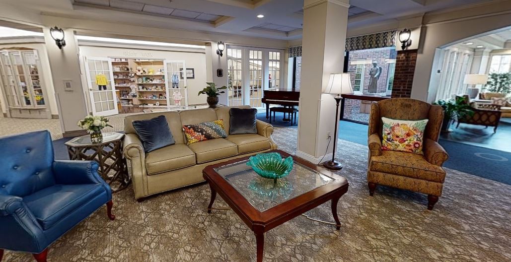 A cozy living room featuring a comfortable sofa, elegant coffee table, and inviting decor.