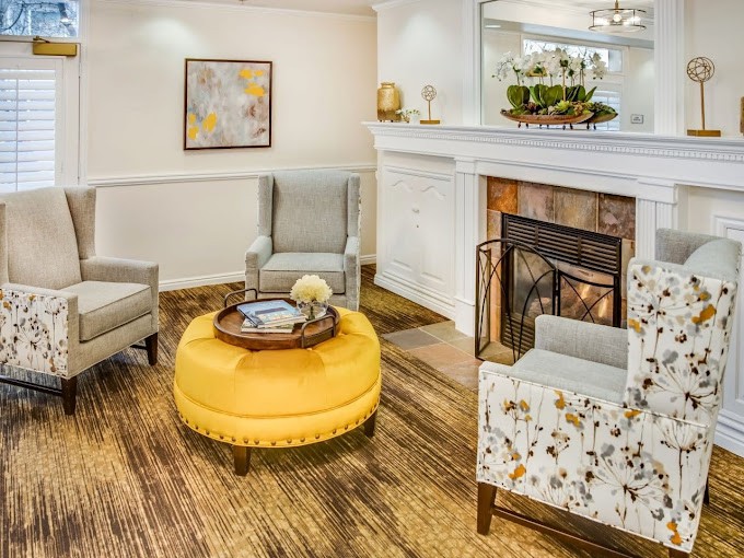 Cozy living room with stylish decor and a warm fireplace.