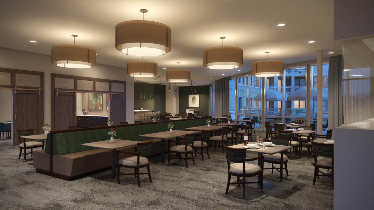 A modern restaurant interior with elegant lighting and arranged seating.