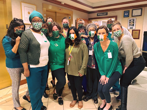 Healthcare team coming together to support each other during challenging times.