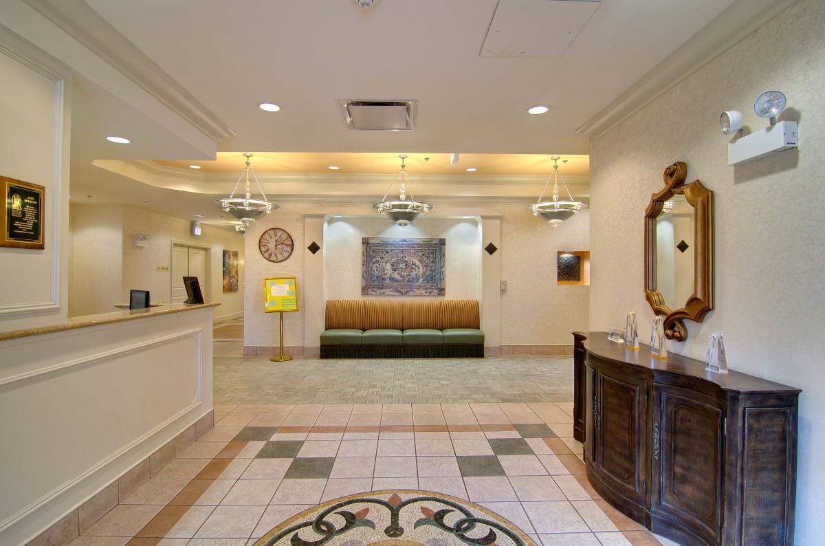 A cozy hotel lobby with elegant lighting and comfortable seating.