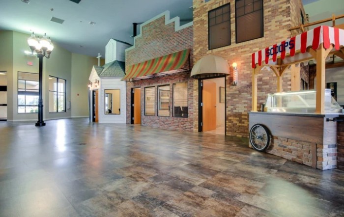 An indoor space resembling vintage storefronts with various architectural designs.