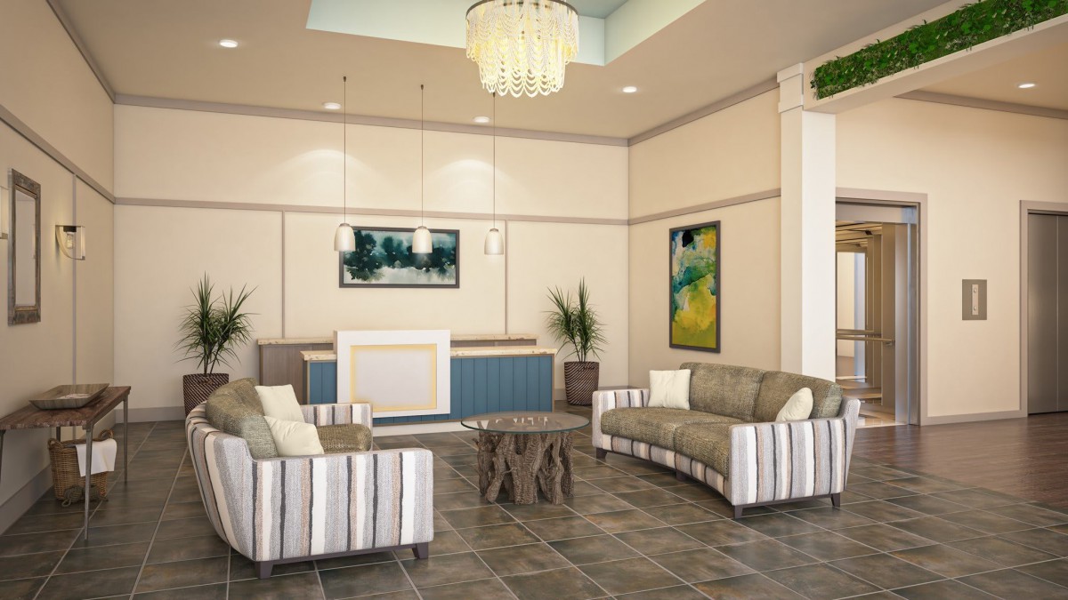 A modern lobby with stylish sofas, a chandelier, and vibrant artwork.