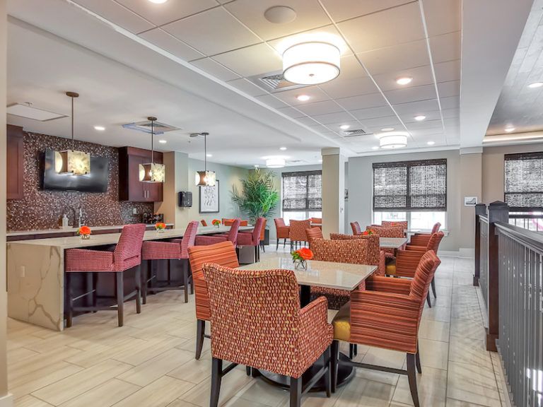 A modern dining area with comfortable seating and ambient lighting.
