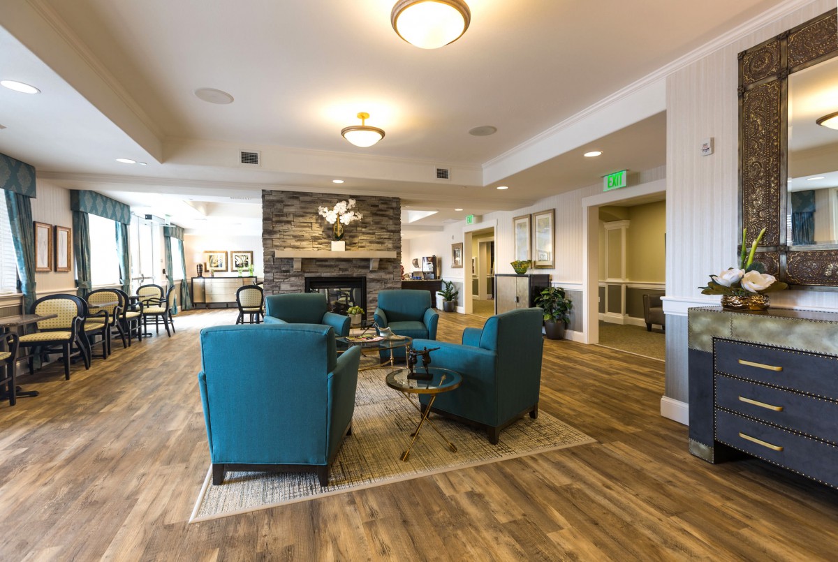 A modern lobby with comfortable seating and a fireplace.