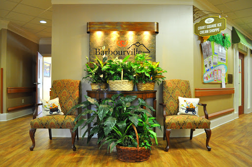 A welcoming lobby with comfortable seating and vibrant plants, creating a warm and inviting atmosphere.