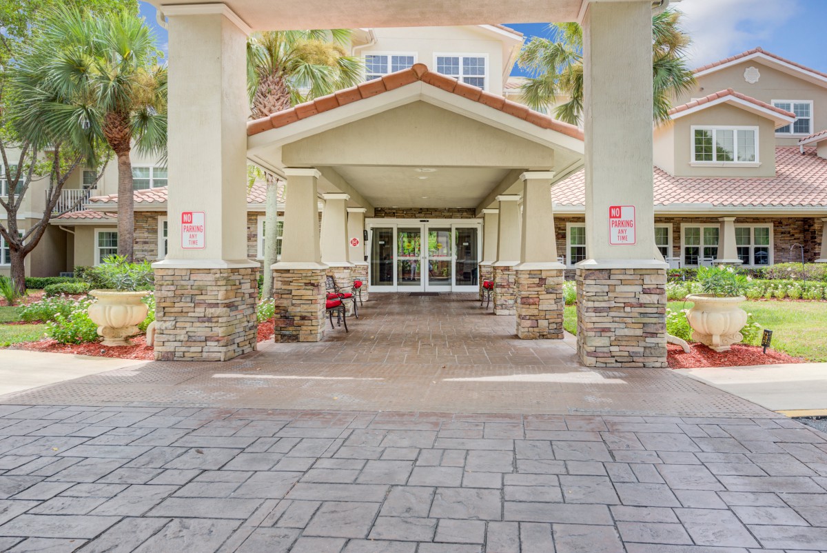Entrance to a building with stone pillars and a covered porch.