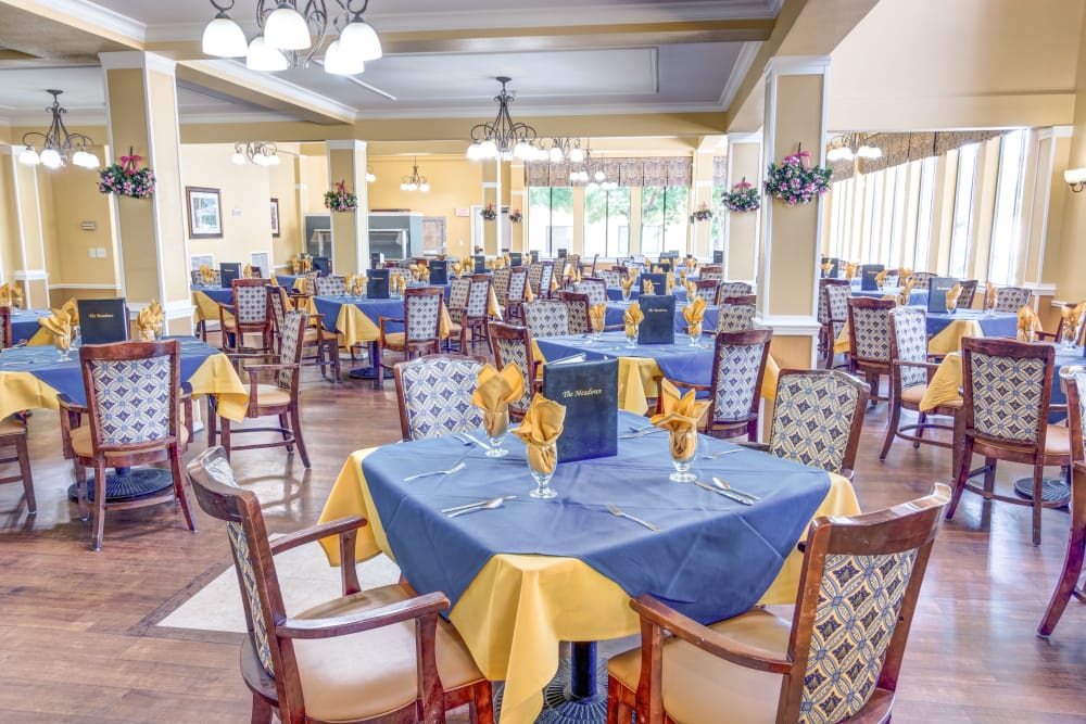 An elegant restaurant dining area with neatly arranged tables and chairs.