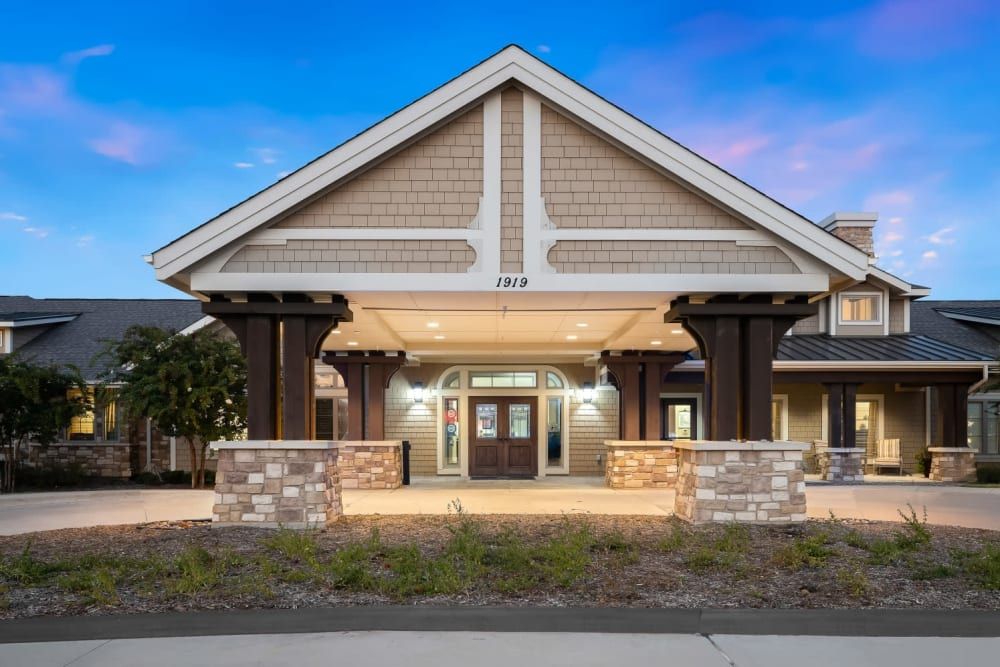 An inviting entrance to a modern building at dusk.