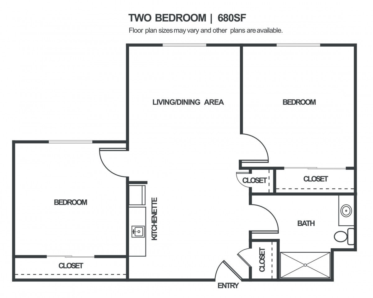 Floor plan of a two-bedroom apartment with living area, kitchen, bath, and closets.