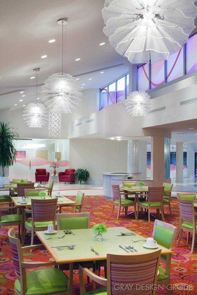 A modern restaurant interior with stylish lighting and contemporary furniture.
