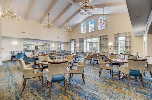 A warm and inviting dining area featuring elegant decor and ample seating.