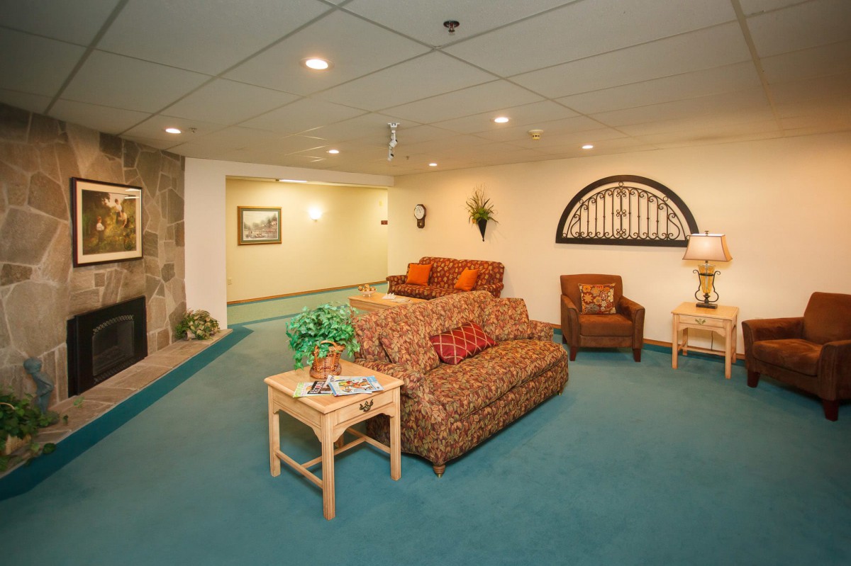 A cozy lobby area featuring comfortable seating and warm decor.