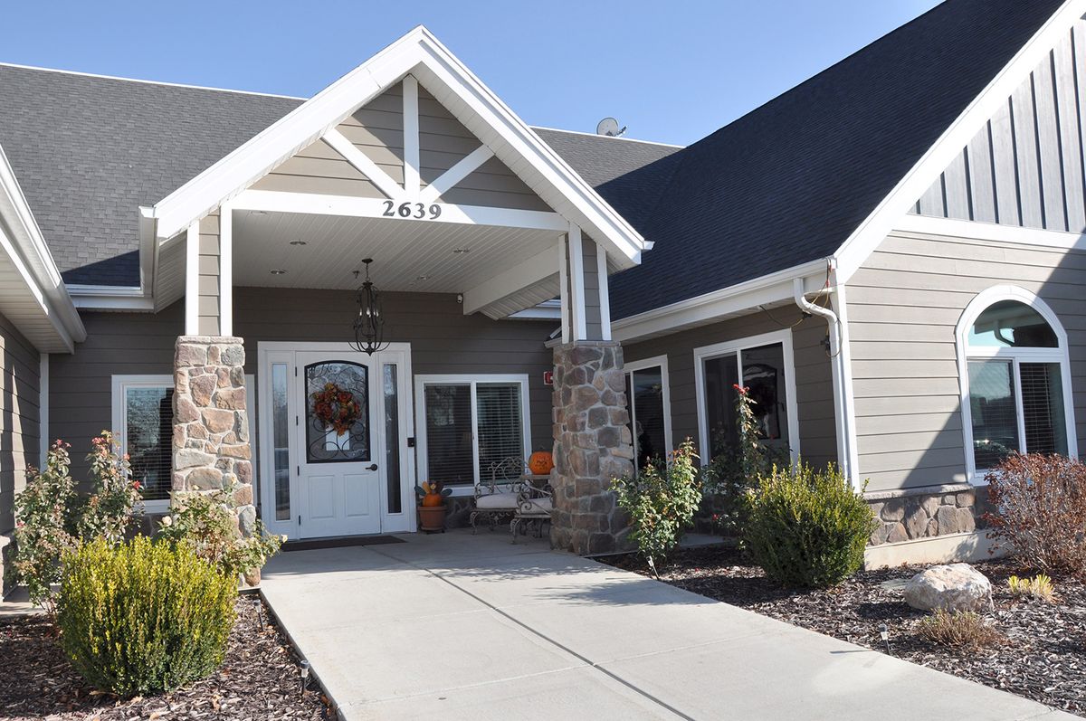 A modern residential house with a well-maintained front entrance and landscaping.