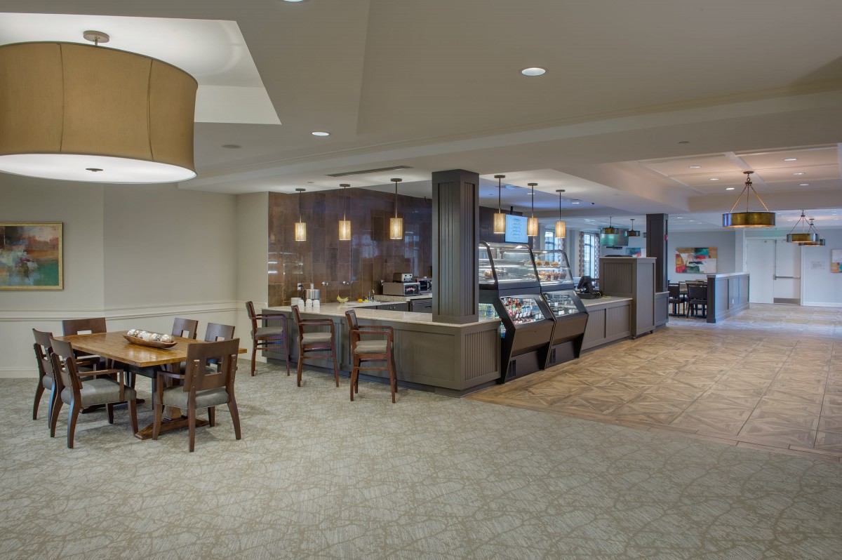 A cozy cafe interior with a seating area and counter service.