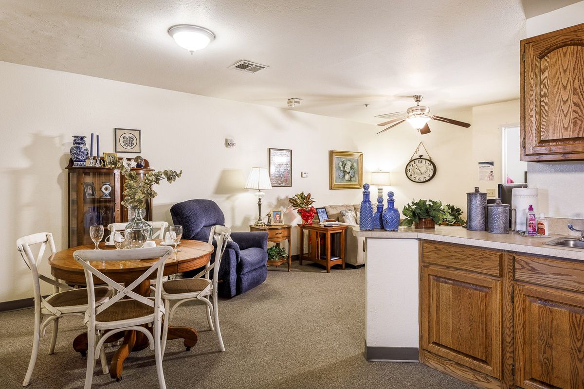 A cozy living and dining area with comfortable seating and decorative elements.