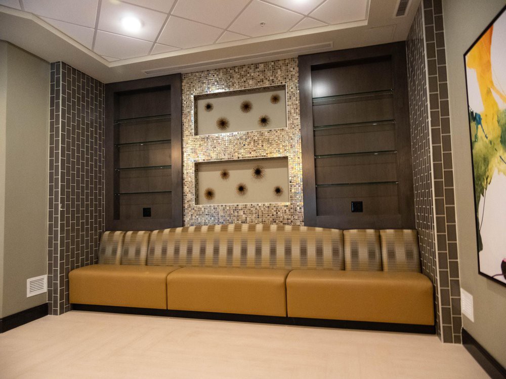 A modern lobby area featuring stylish seating and decorative wall elements.